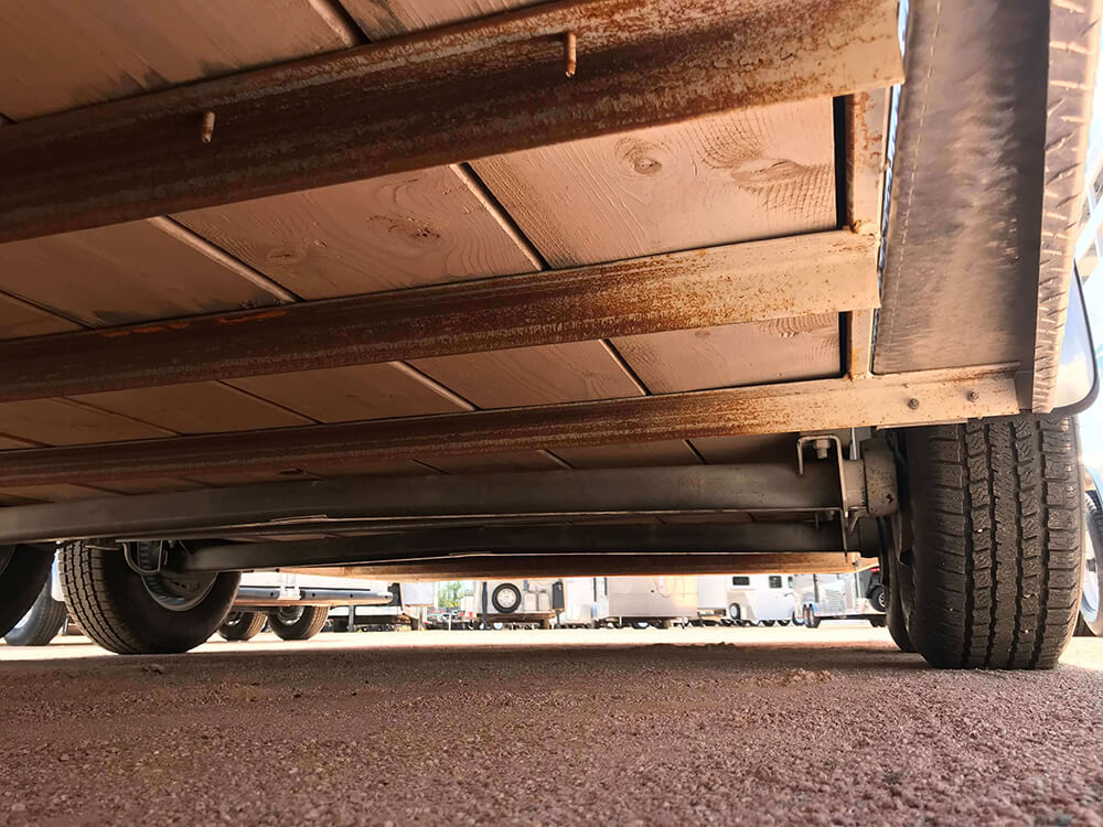 Trailer base steel frame with 2 x 10’s wood plank supports left in place.