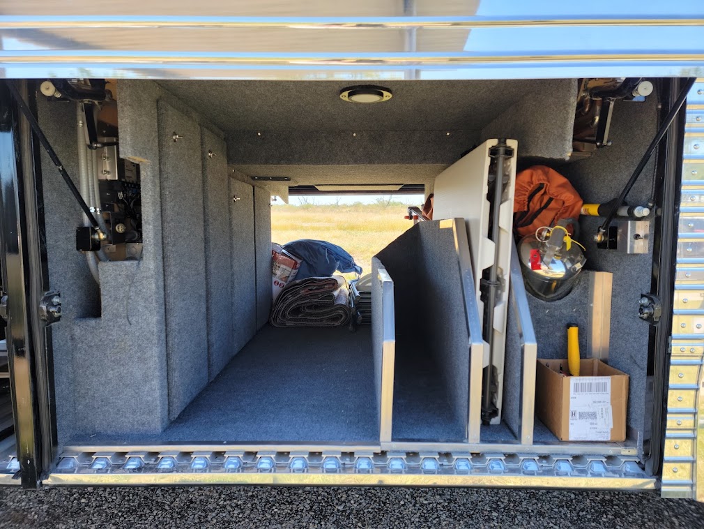 Curbside front storage bay.