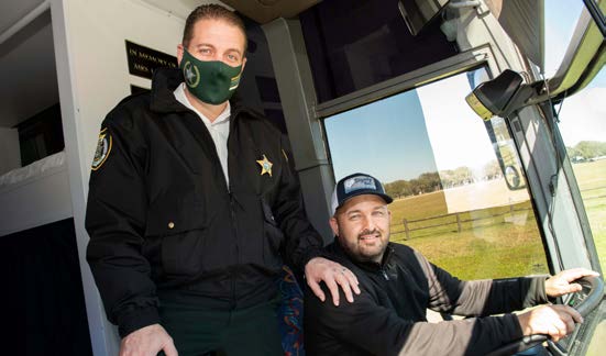 Sheriff Eric Flowers with Tony Zorbaugh in the driver’s seat.