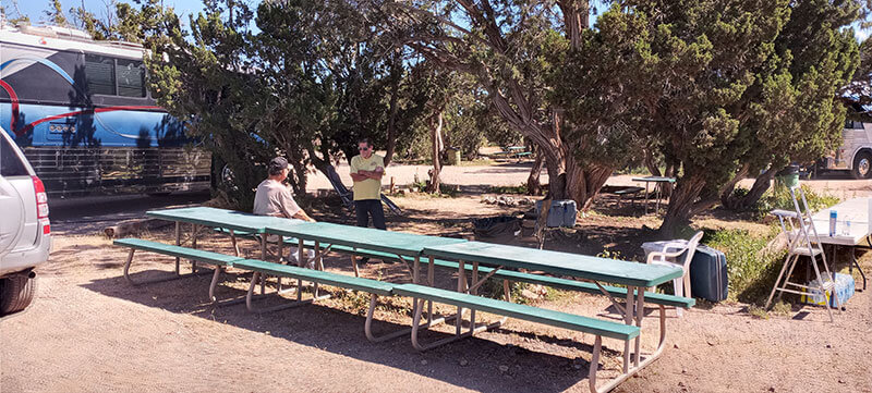 Our meeting area in the shade with picnic tables.