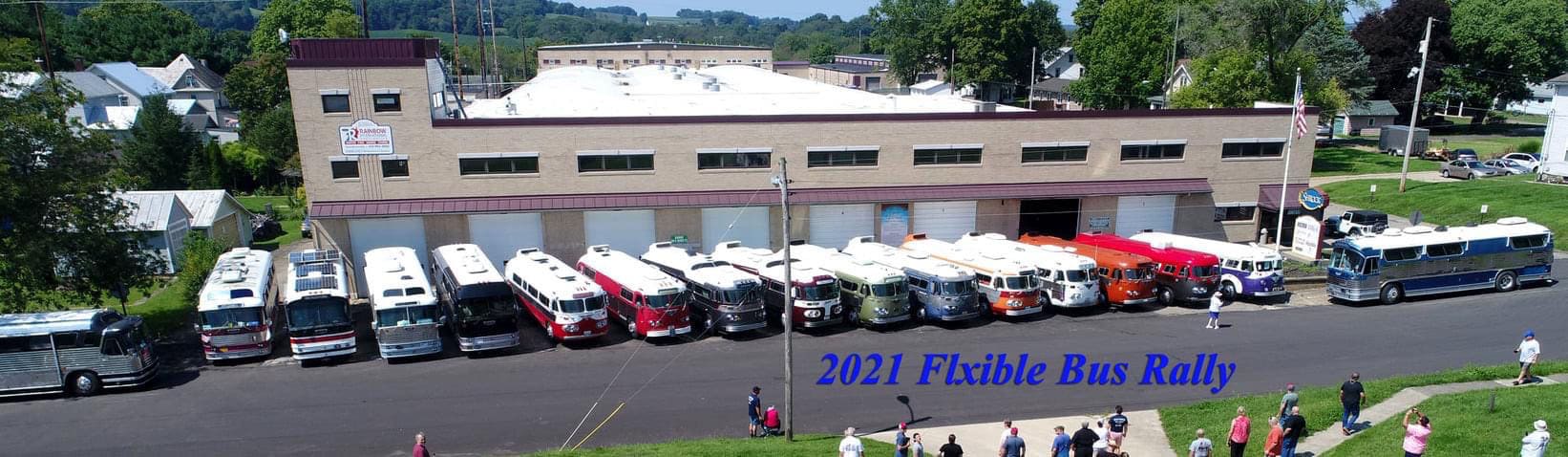 Flxible buses lined up in front of the old Flxible Fac-tory during the 2021 rally.