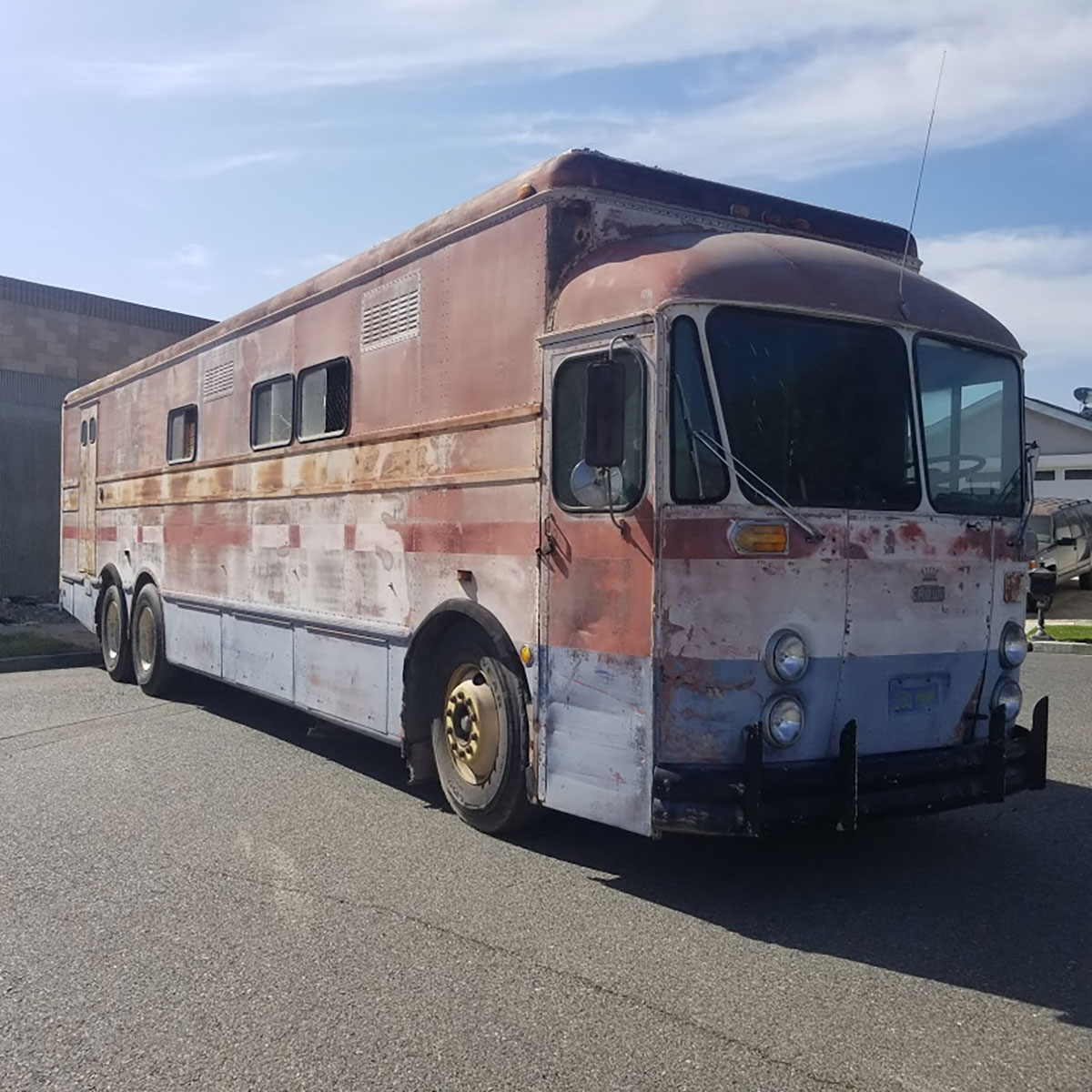 Highway Post Office Buses used in the early 1960s had very few windows as postal employees used to walk around inside sorting mail while traveling from one distribution center to the next and there were pigeonholes all along both walls for sorting mail. This one recently sold in Southern California.