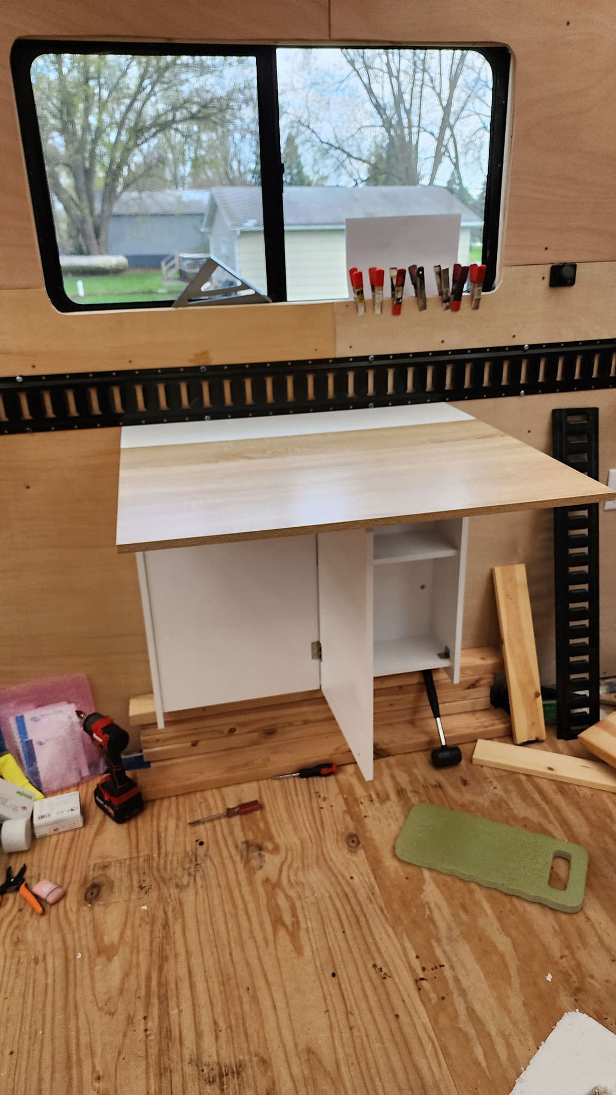 Fold up table in open position under the window.
