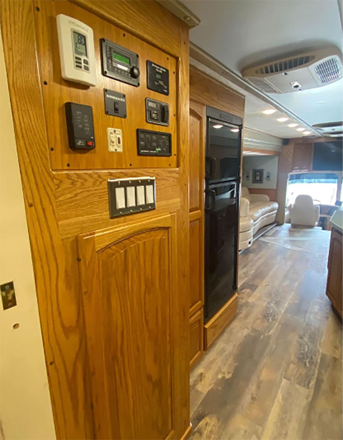 The control panels and refrigerator.