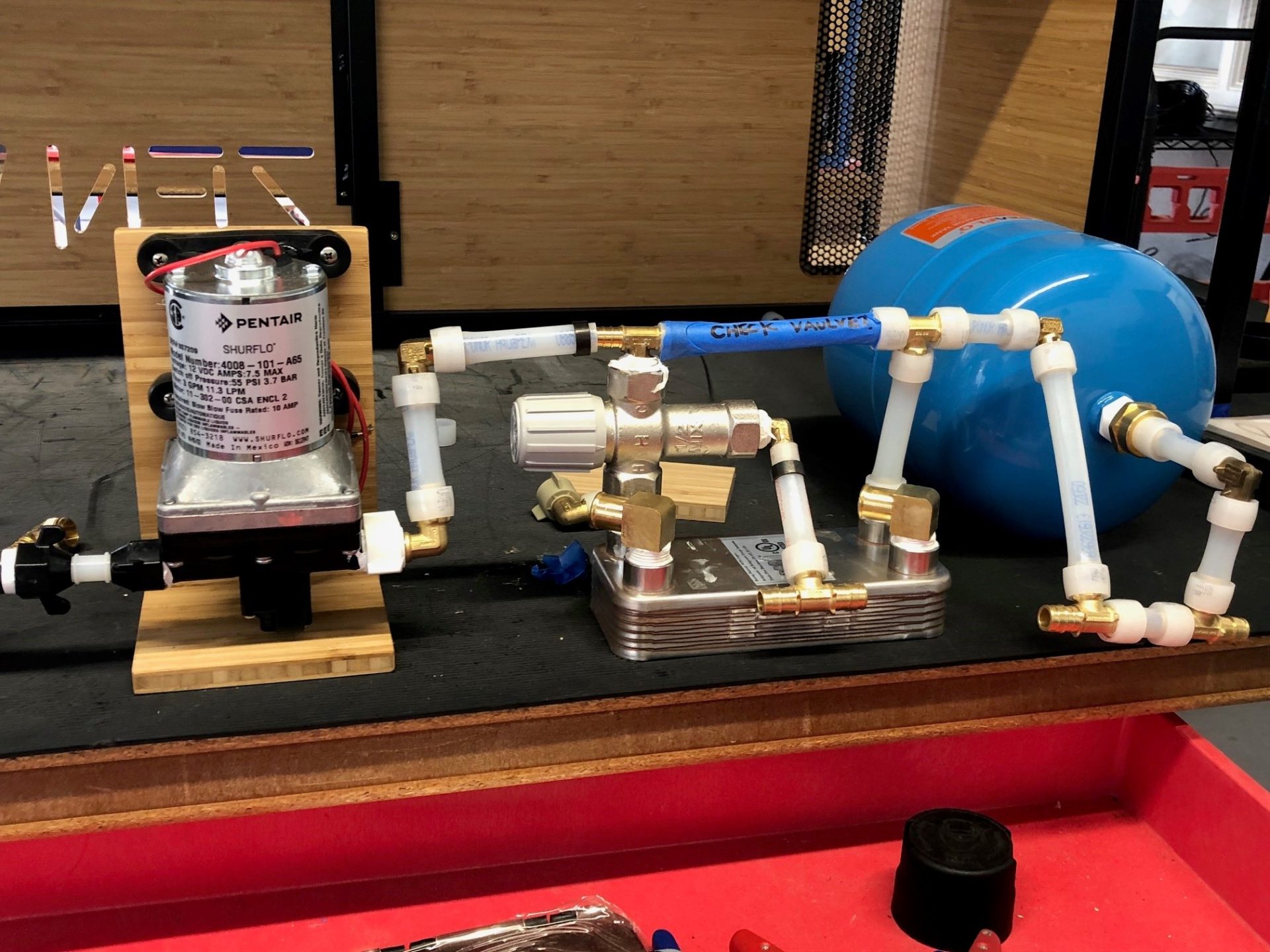 The water system was assembled on the bench and installed as a unit.