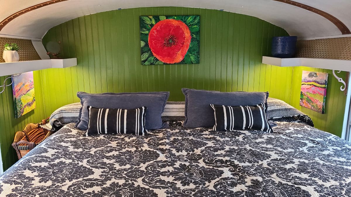 Airbed over a 100-gallon water tank.