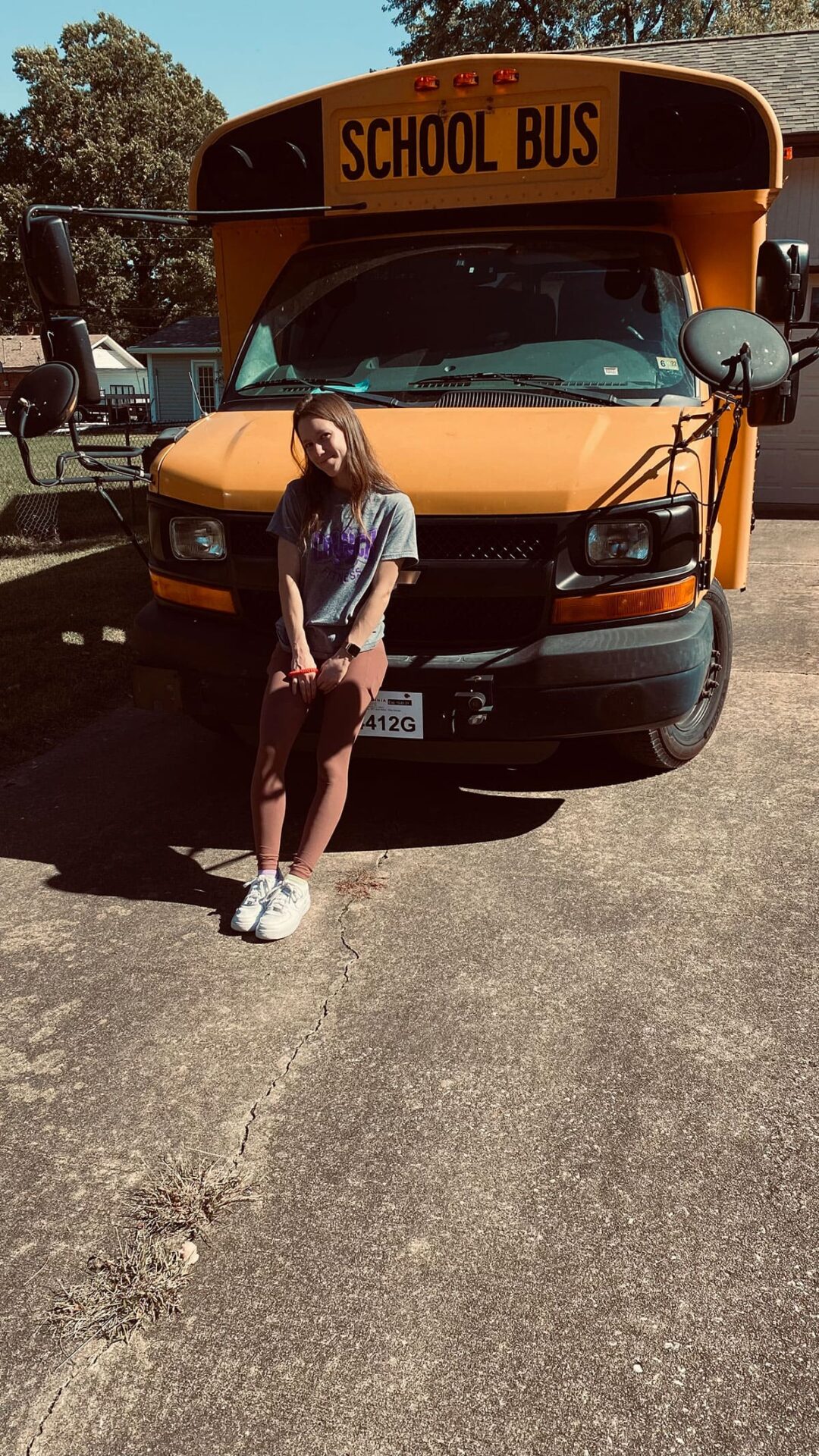 Courtney posing in front of our new bus. Courtney posing in front of our new bus.